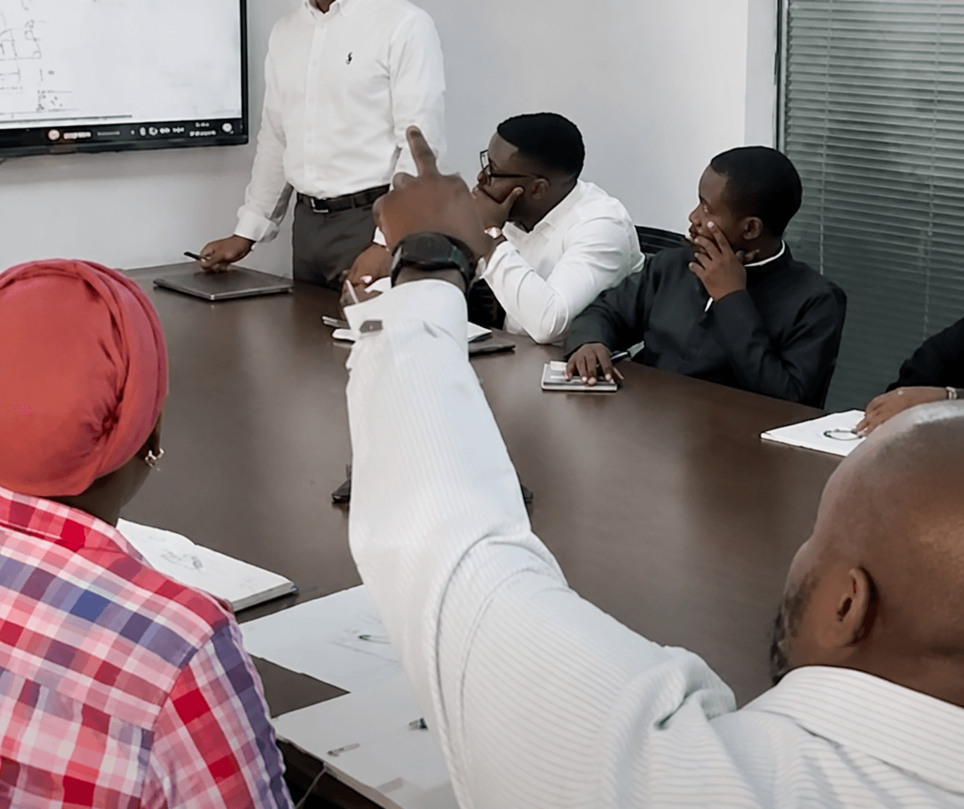 ECAD team members collaborating during a meeting